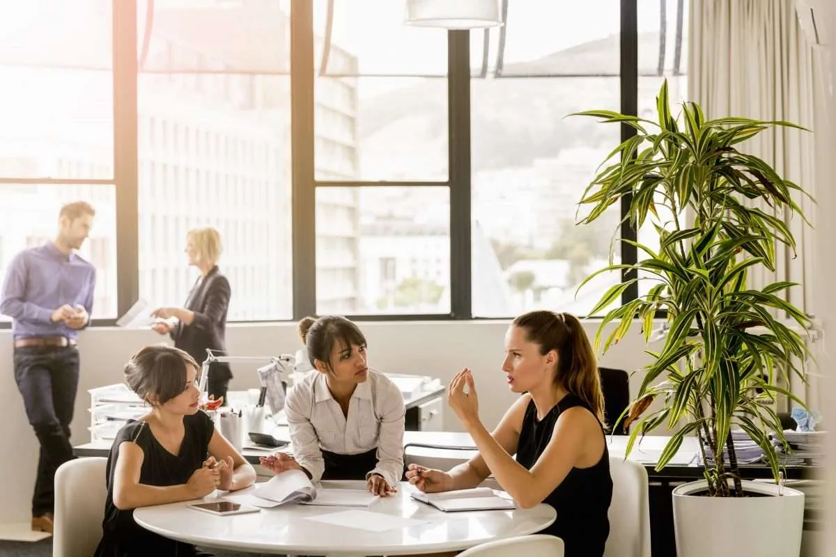 Sales team in a meeting reviewing why they are not hitting their sales targets